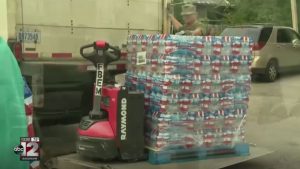 Church water distribution continues to draw large crowds